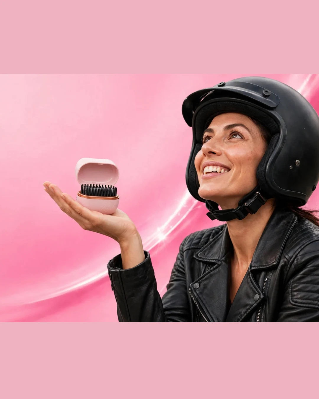 Woman with motorcycle helmet holding the NOEILI cordless styling brush